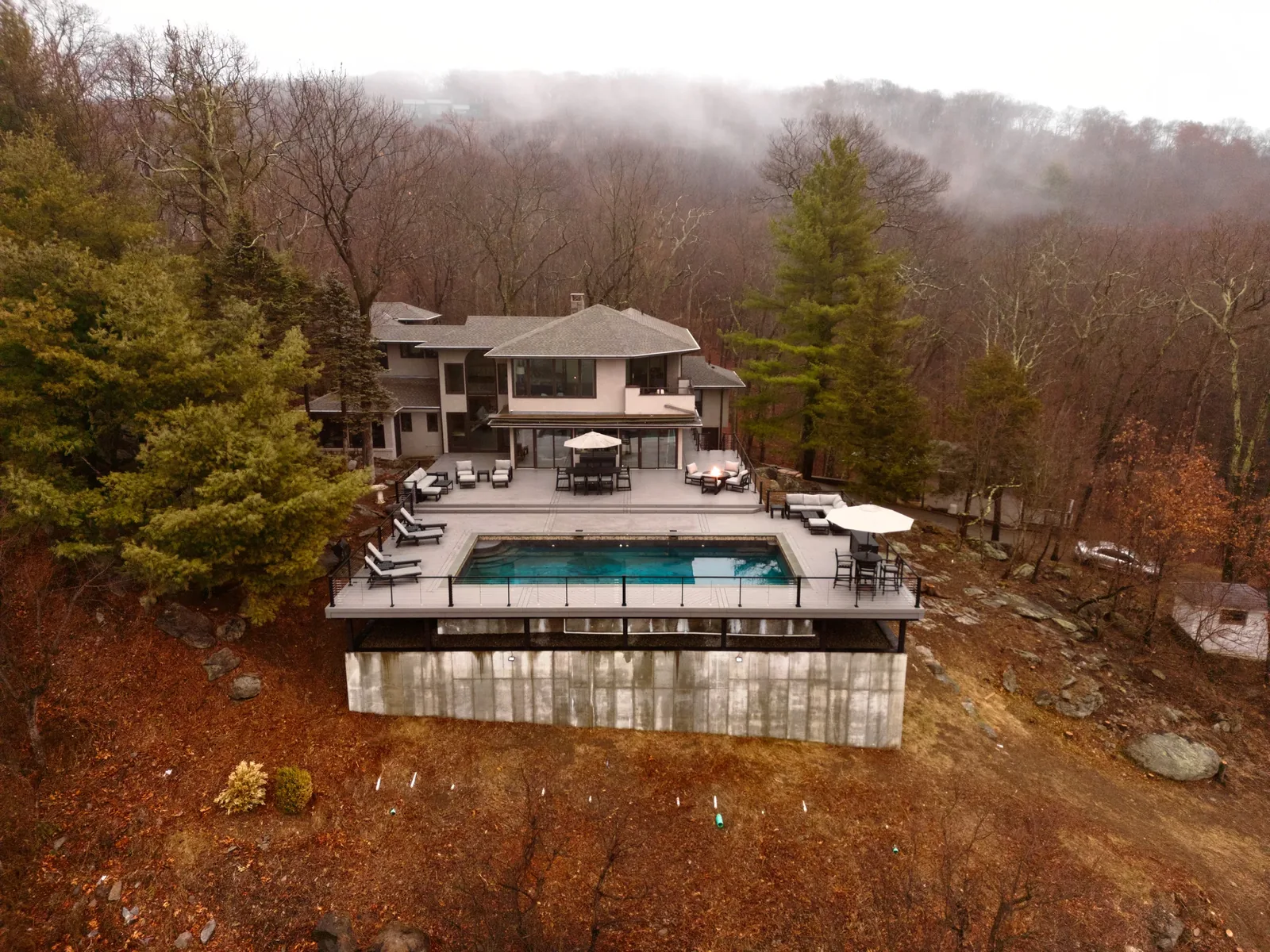 Pool and deck in morning fog in the Hudson Valley