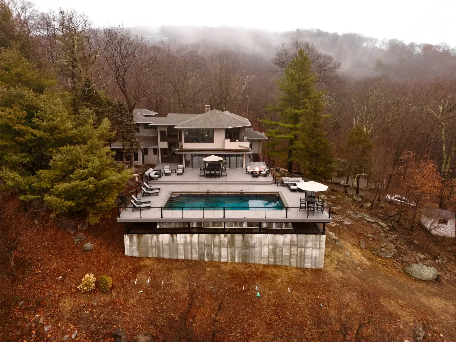 Fog over a Hudson Valley pool deck in the early morning
