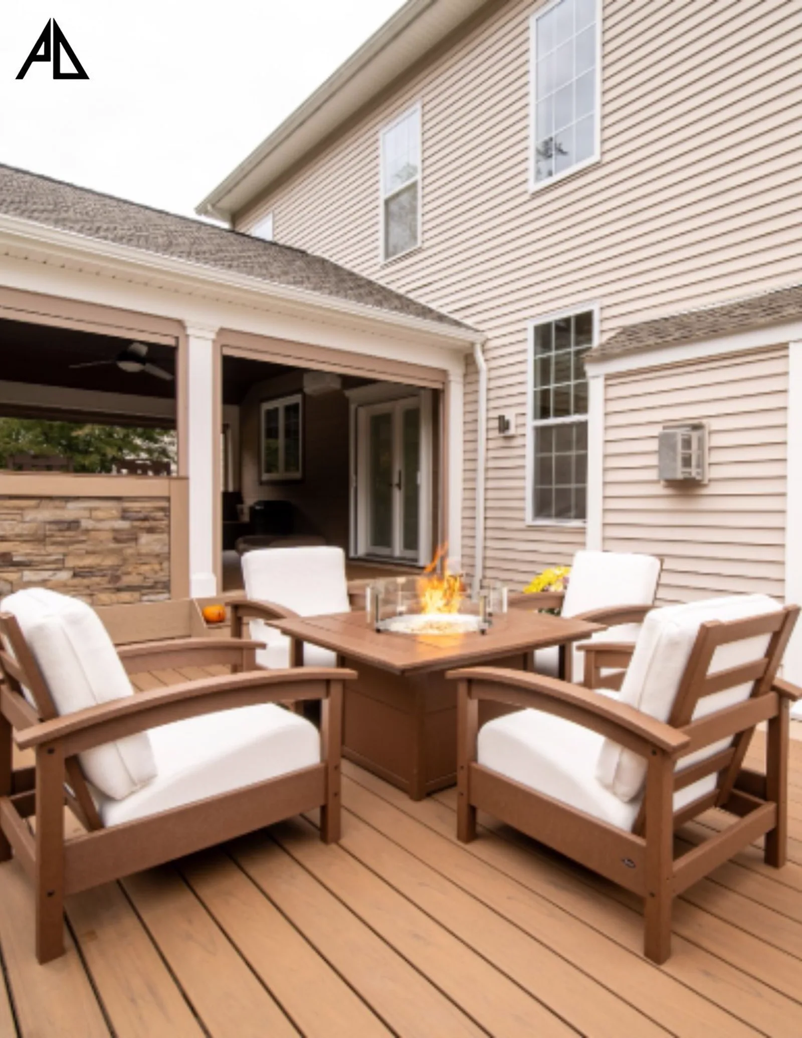 Finished covered deck with a fire table and lounge chairs