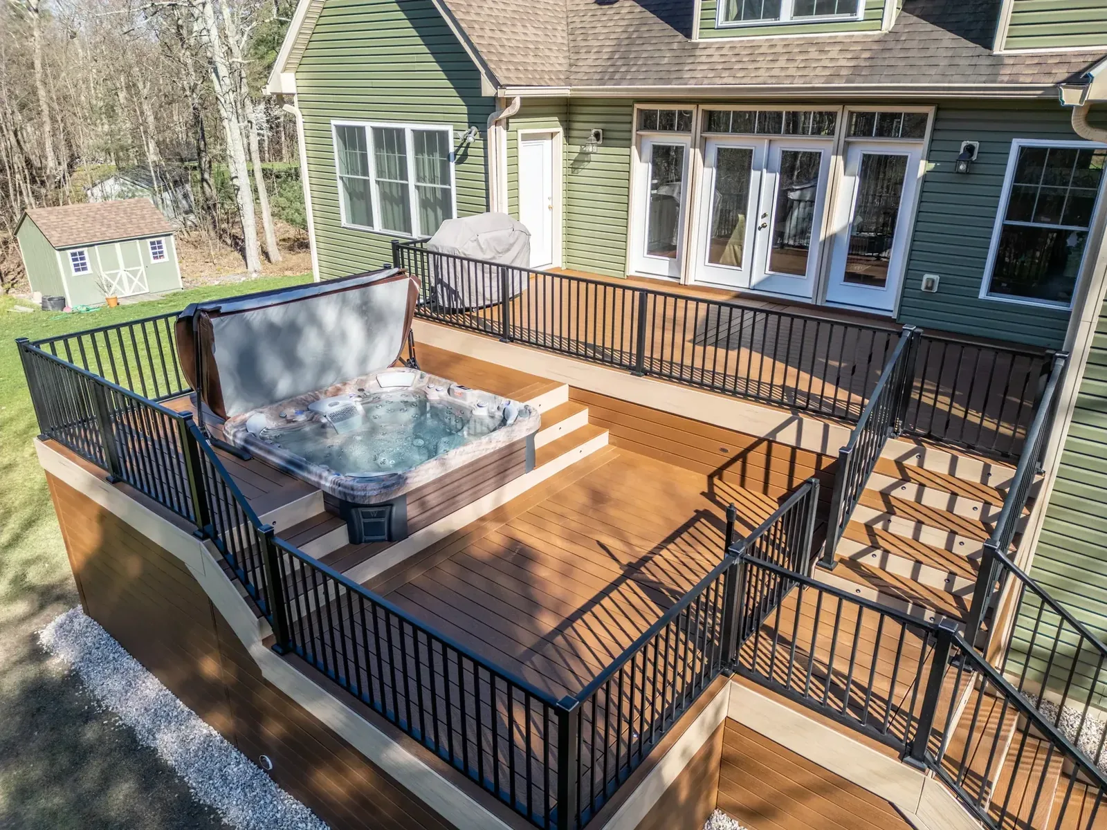 Composite deck with hot tub and aluminum railing
