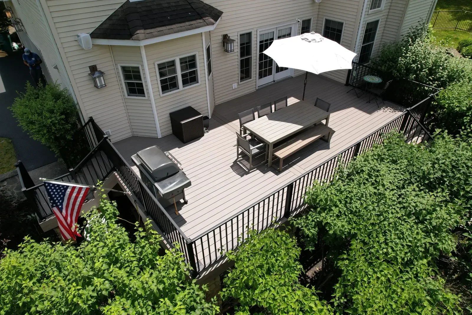 Composite deck with lounge furniture and pergola, low maintenance honestly told