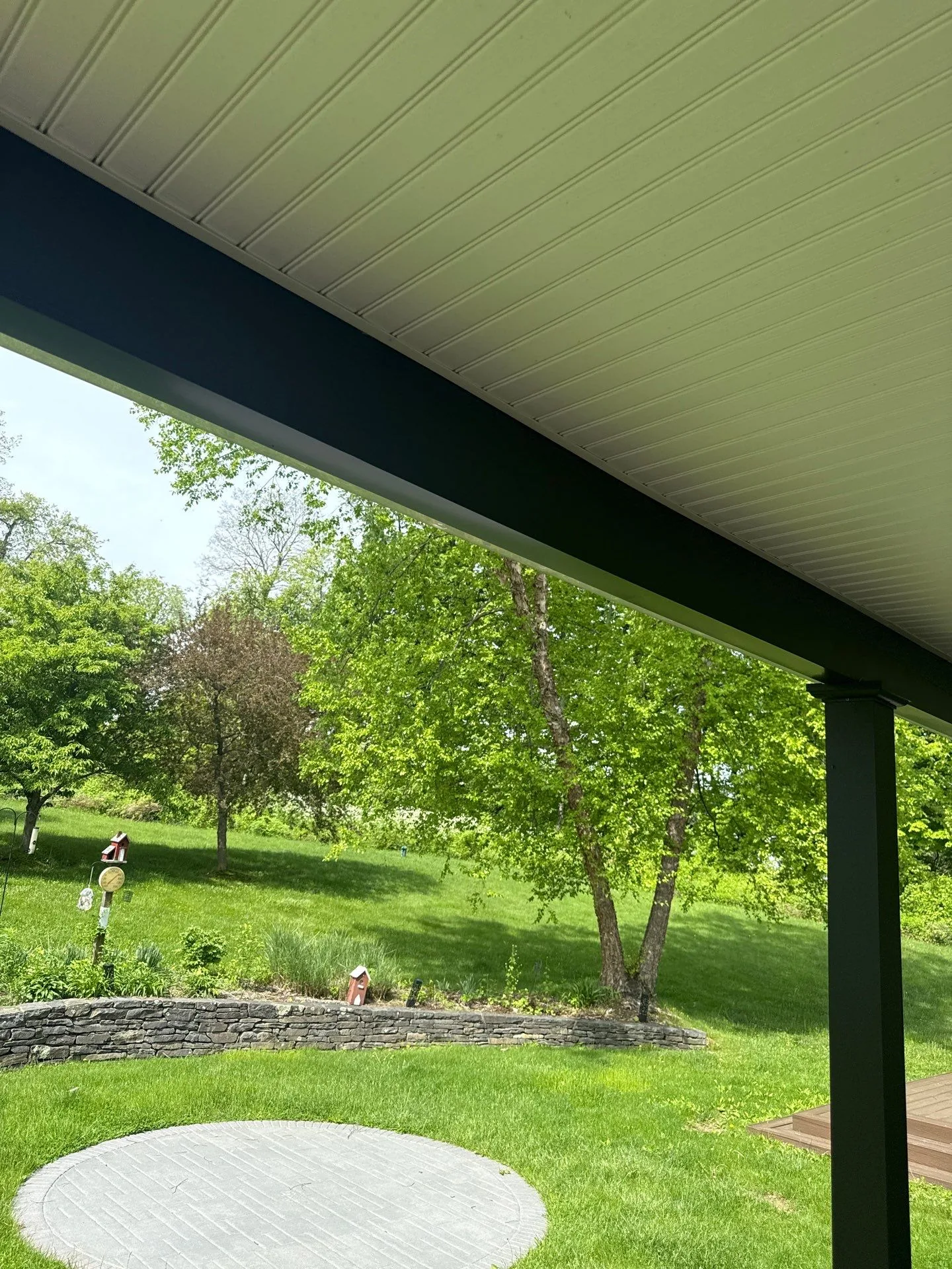 Black structural post-and-beam farmhouse deck — detail that belongs in a real proposal