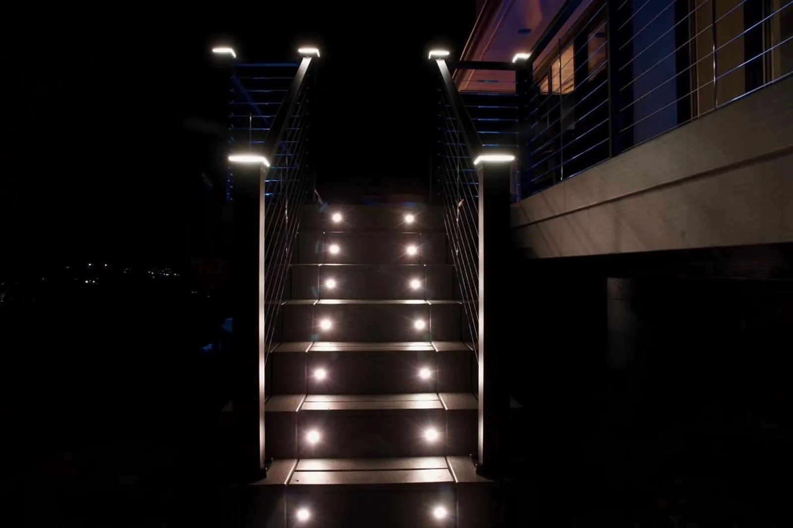 Teal LED riser lights on pool deck stairs, Hudson Valley