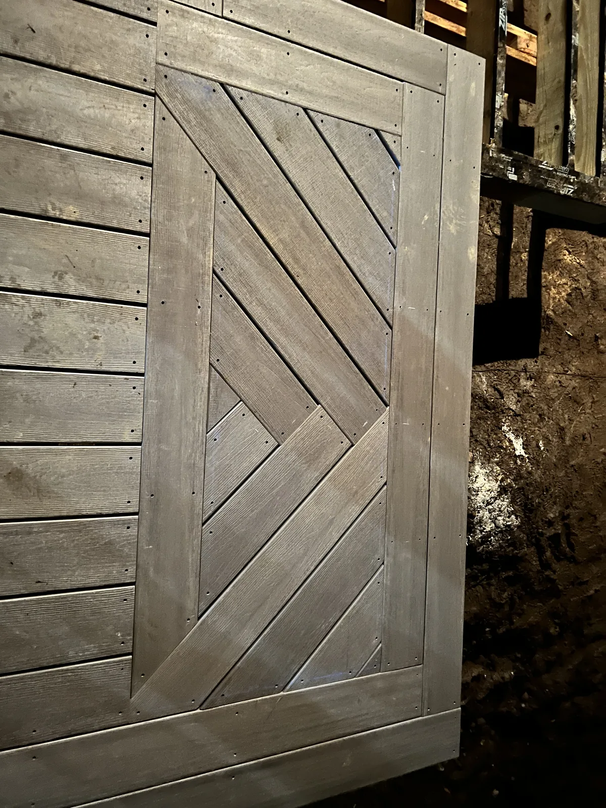 Custom chevron inlay detail with picture-frame border during installation