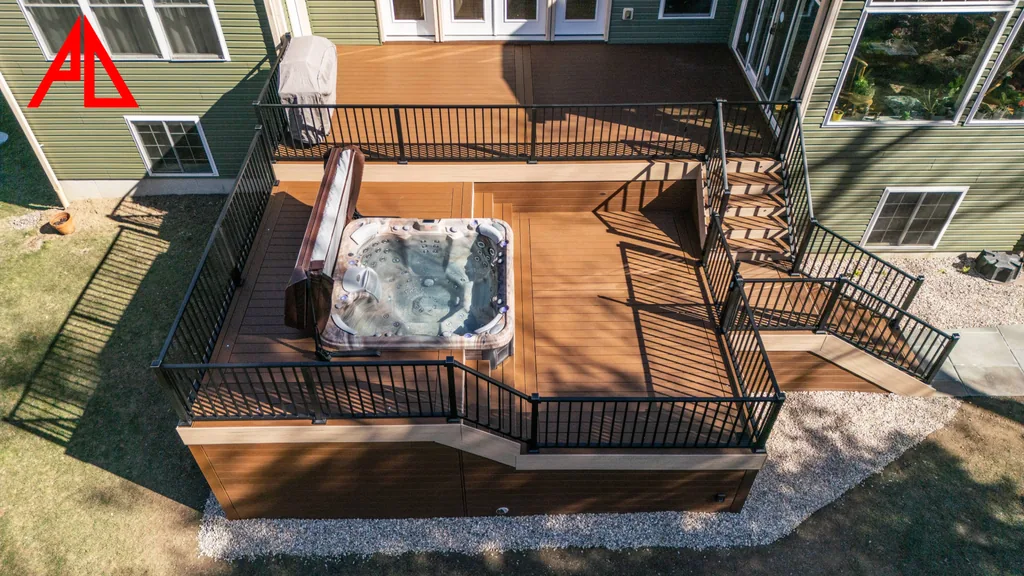 Aerial view of a two-tier composite deck with a sunken hot tub