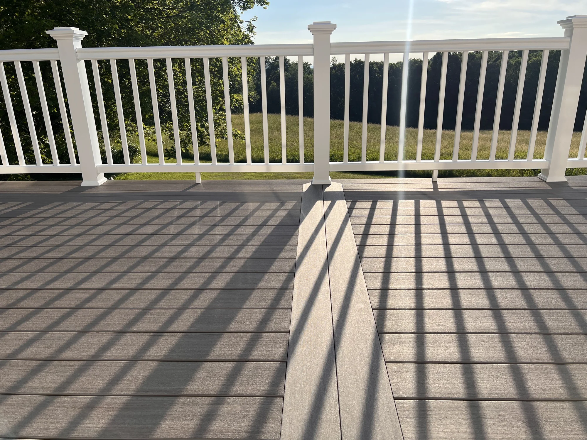Trex composite deck with a white railing detail