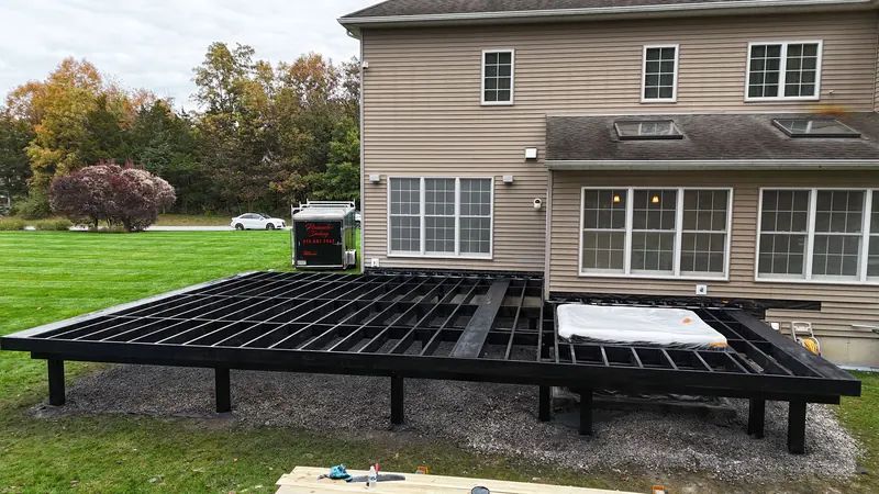 Open deck framing set on posts and footings, ready for joist tape and decking, Hudson Valley Pinnacle Decking job