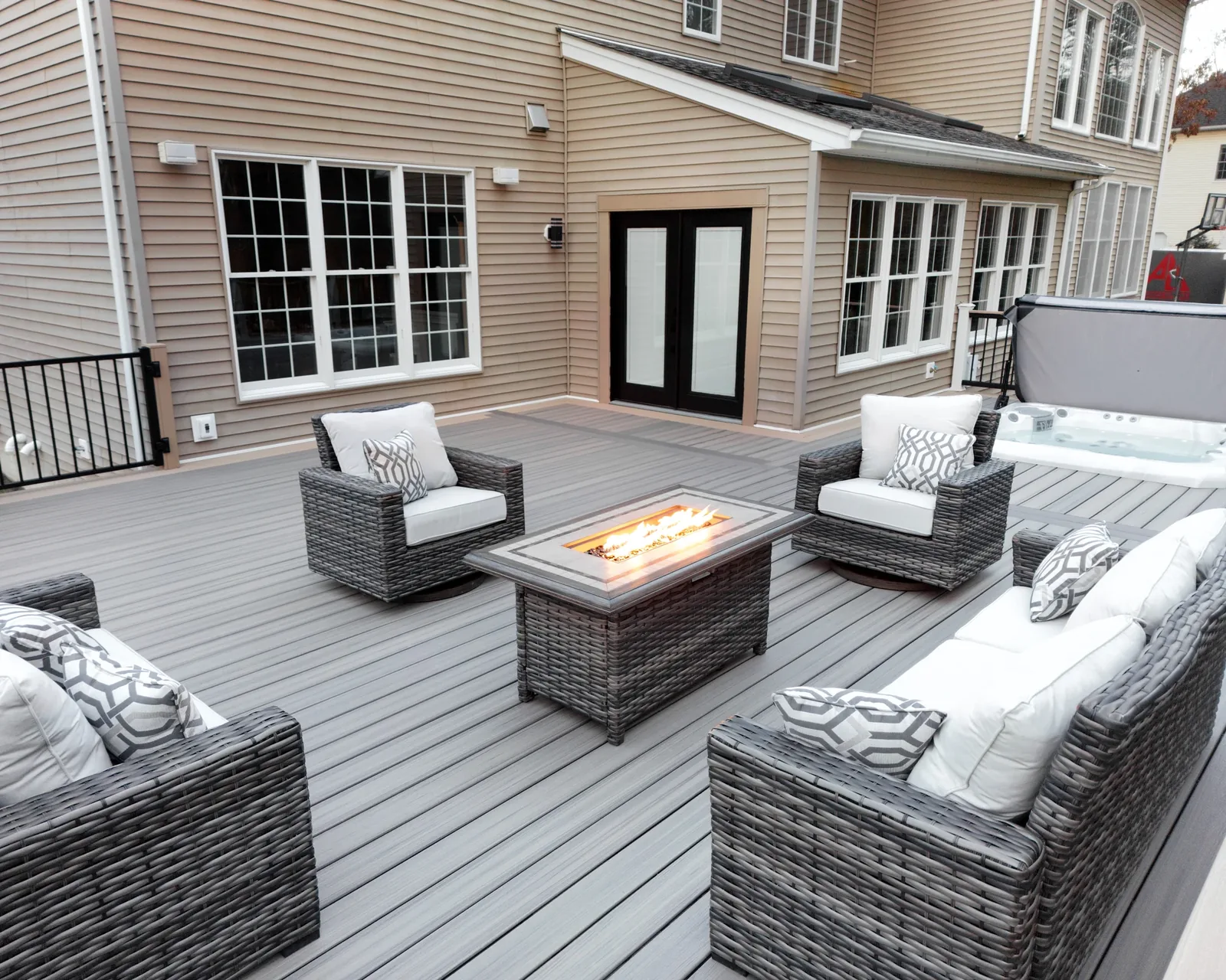 Fire pit and built-in seating on a composite deck
