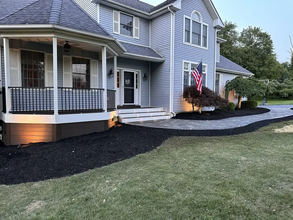 Covered porch outdoor living at dusk