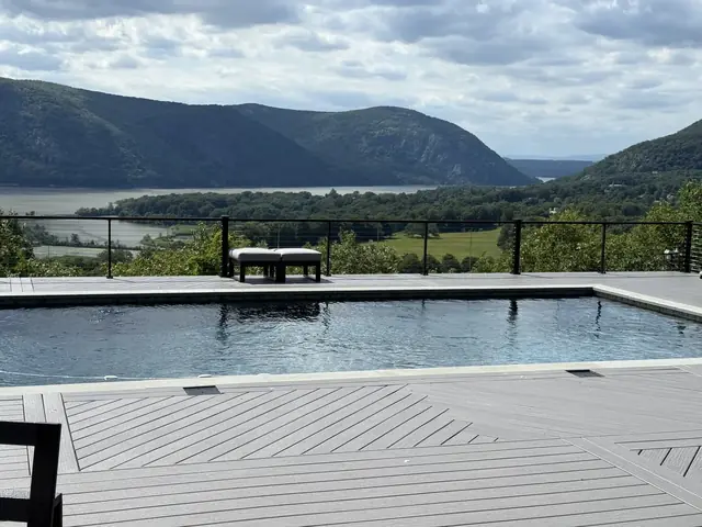 Clifftop pool deck with cable railing above the Hudson, Garrison, NY