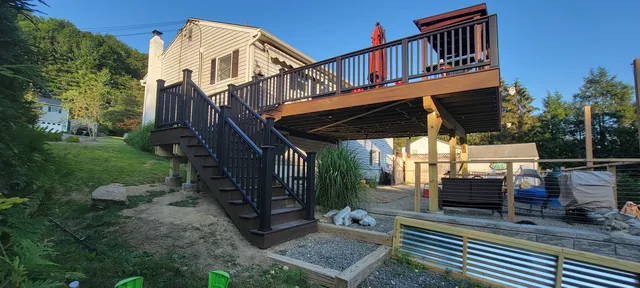Elevated deck with dark railing and stairs, Putnam County