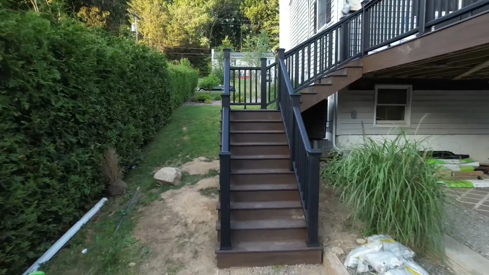 Elevated deck stairway with black railing in Putnam County, NY