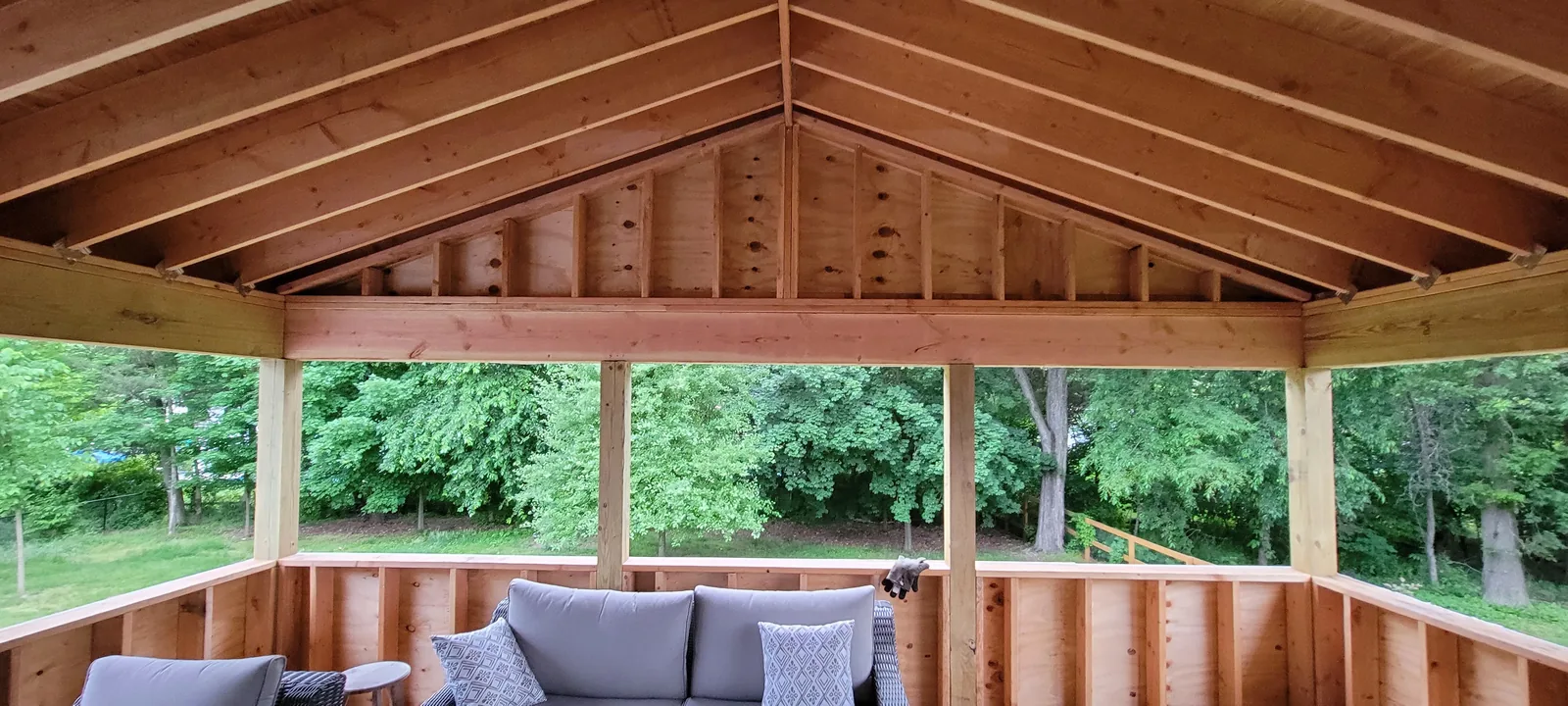 Four-season room with a vaulted wood ceiling and lounge seating in Wappingers Falls, NY