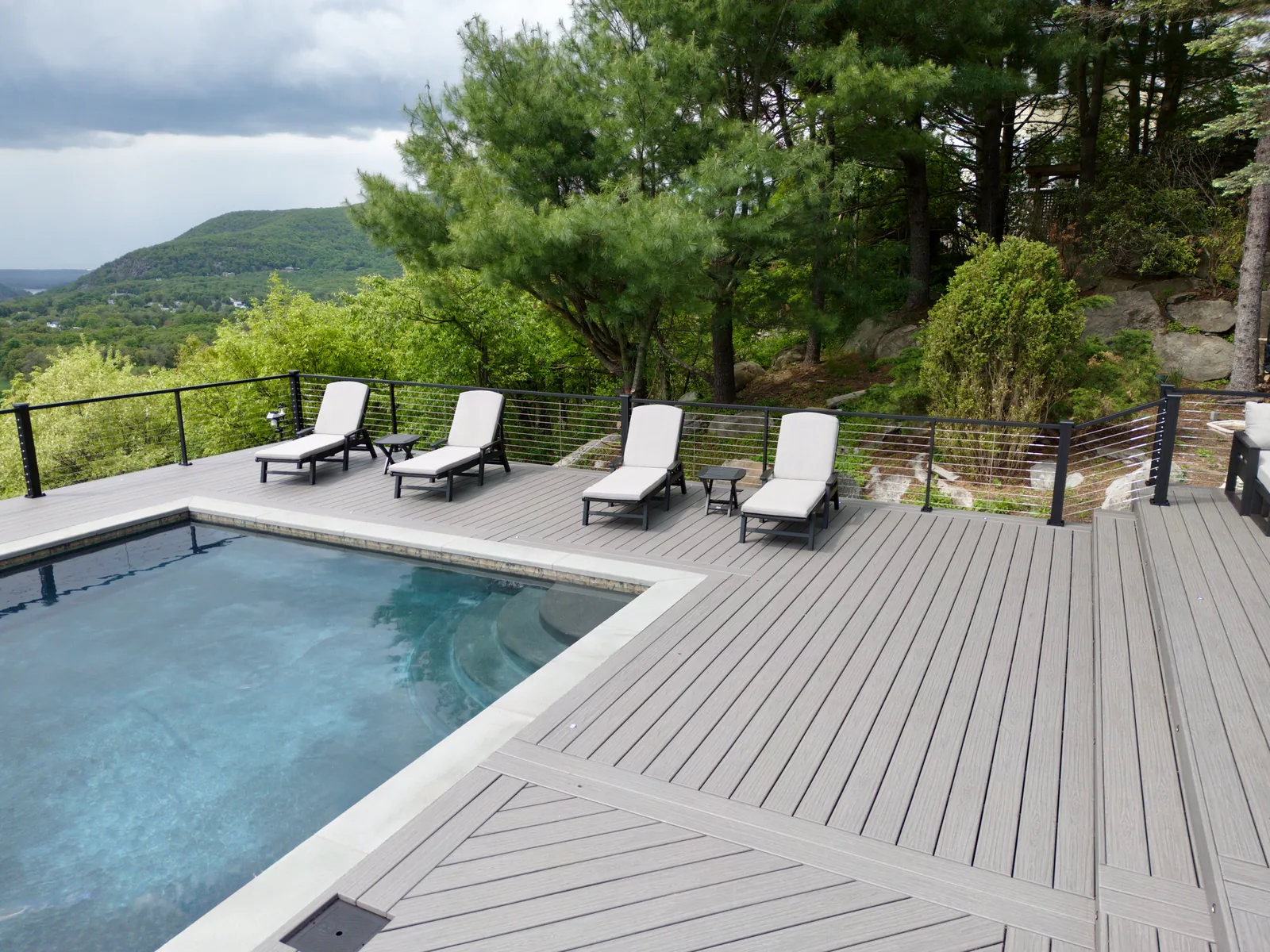 Picture-frame Trex deck with pool and Hudson Highlands vista in Garrison, NY
