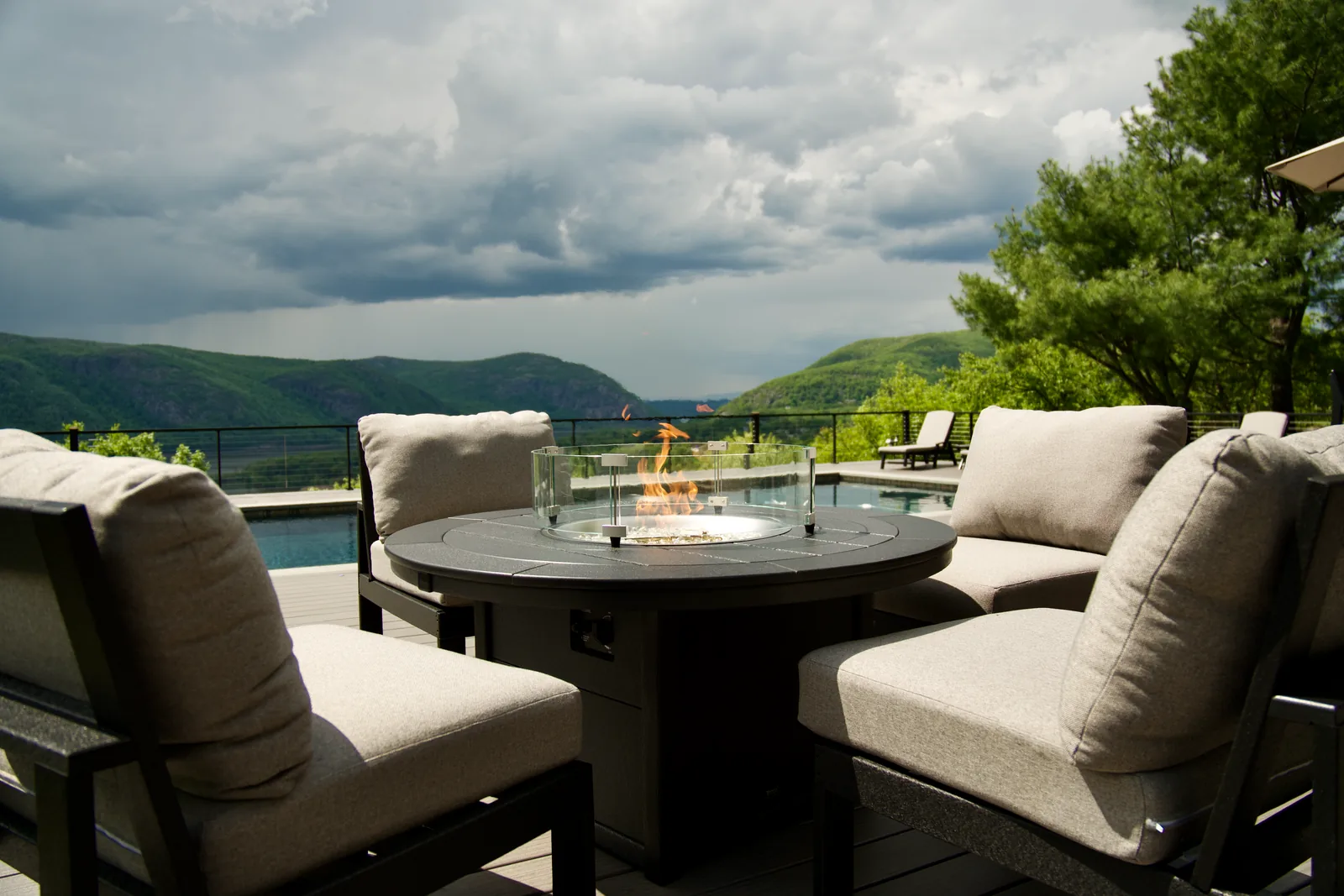 Fire-table lounge with a mountain backdrop in Garrison, NY
