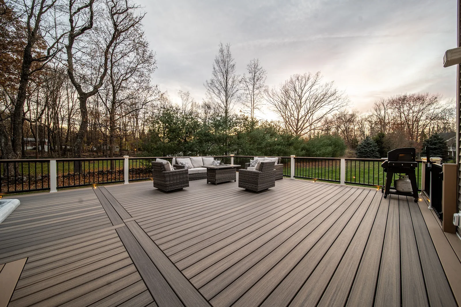 Dusk composite deck with lounge seating and grill in the Hudson Valley, NY