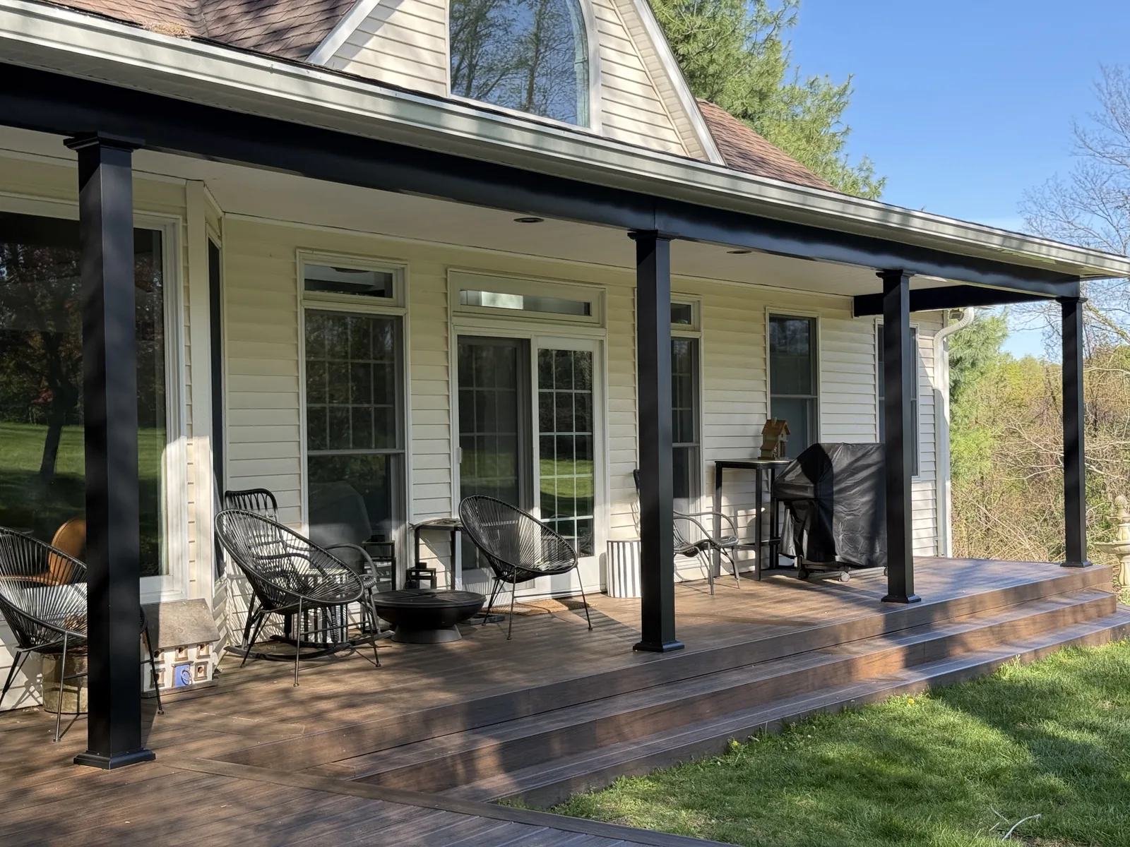 Covered farmhouse deck with black structural aluminum posts and beams, Hyde Park, NY