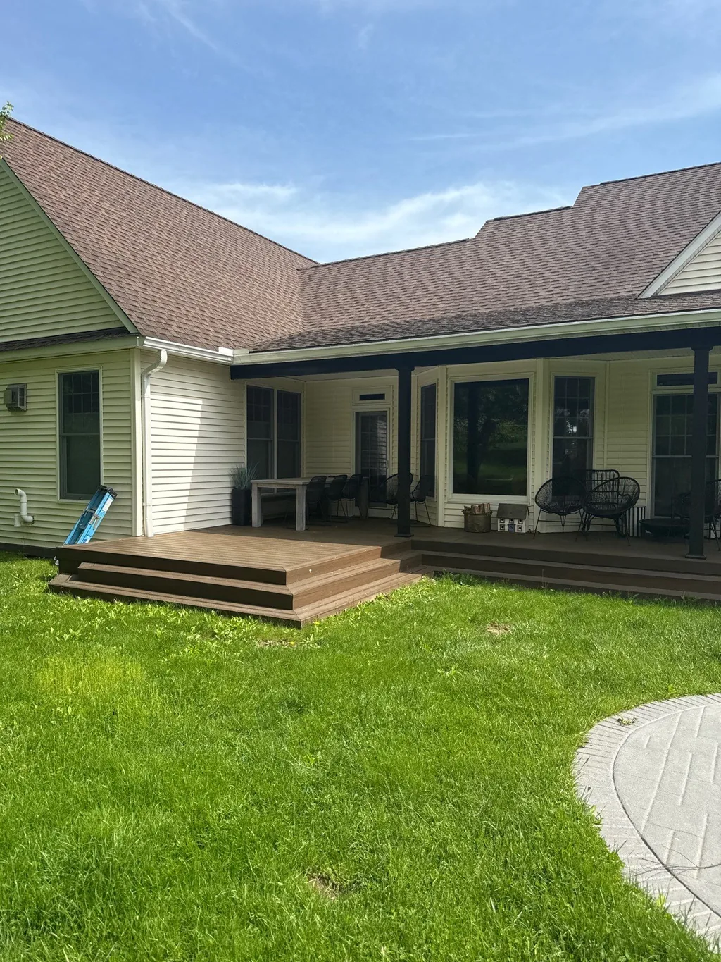 Farmhouse deck with black structural post-and-beam, Hyde Park area