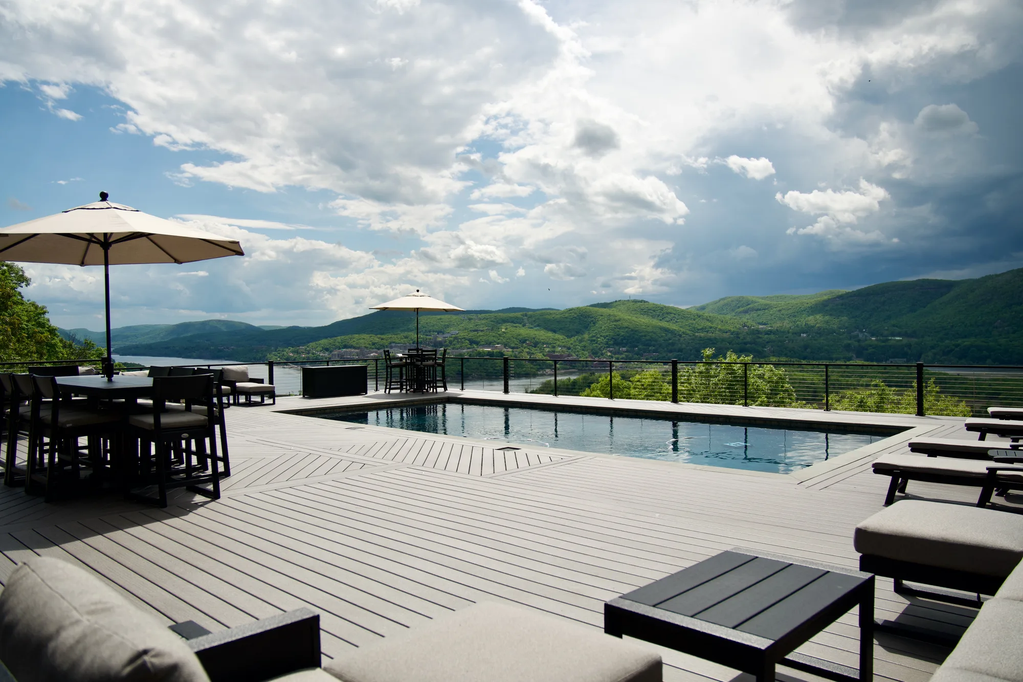 Large composite pool deck with railing in the Hudson Valley