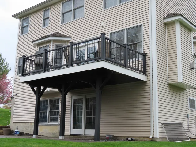 Second-story composite deck with black railing