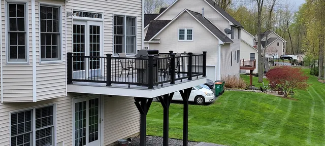 Second-story composite deck with black railing