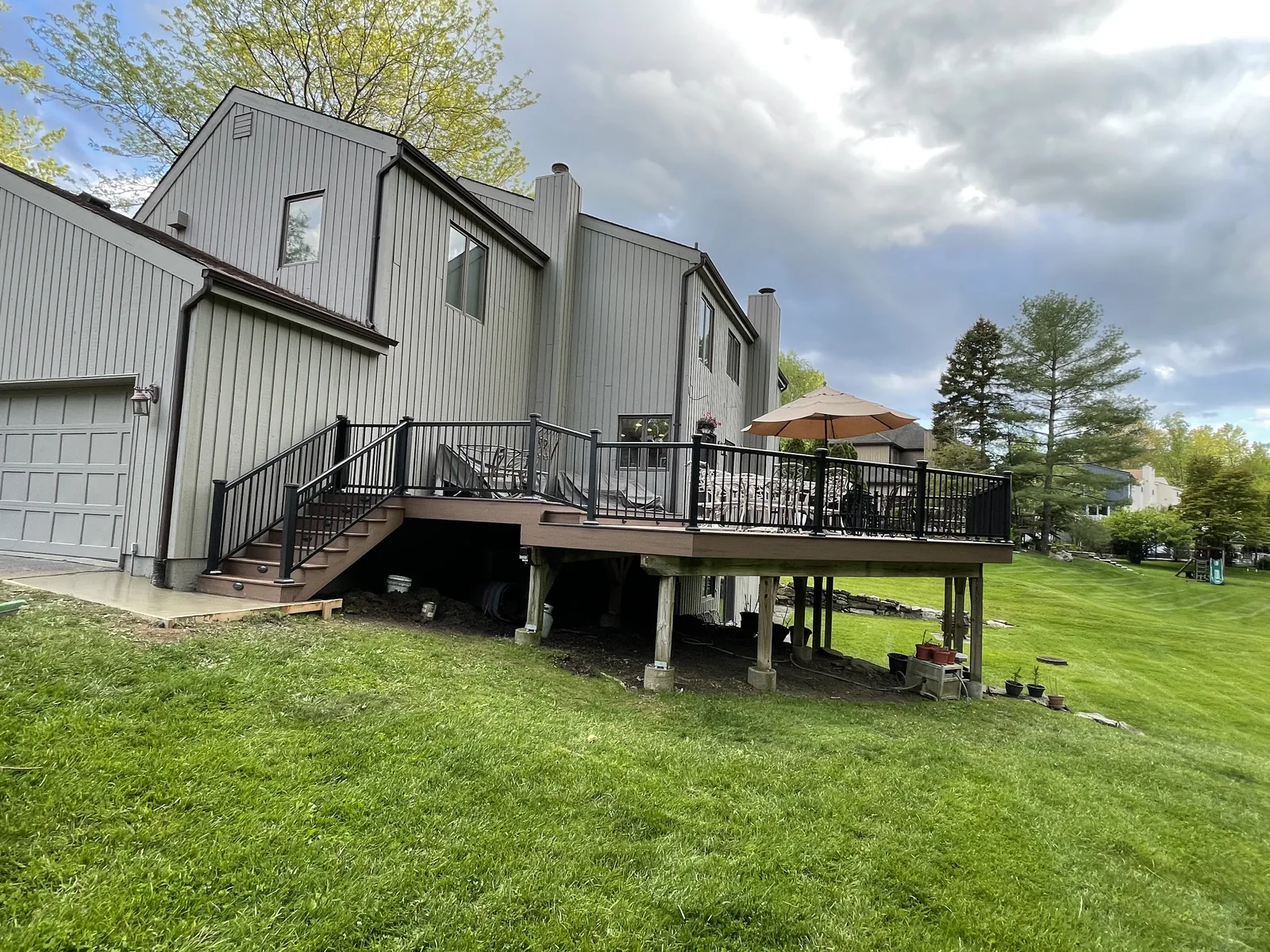 Raised deck with metal railing and stair access in Scarsdale, NY (Westchester County)