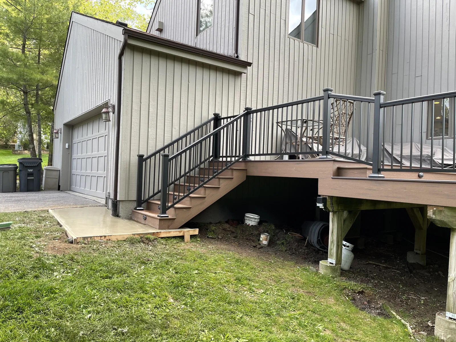 Raised deck with black railing and stairs, Scarsdale, NY