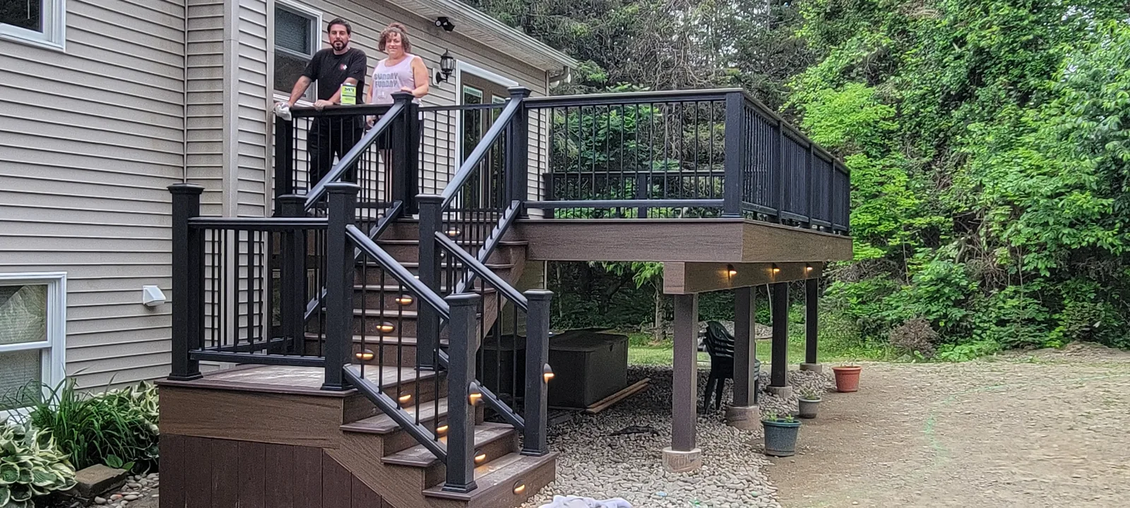 Elevated deck with lighted stairs and railing in Verbank, NY