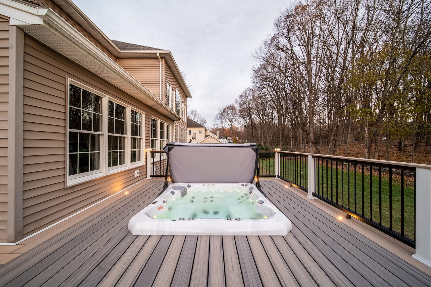Hot tub set into a composite deck feature platform — Pinnacle Decking Hudson Valley NY