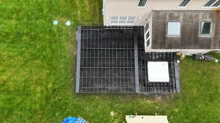 Overhead view of a deck and round fire pit in the Hudson Valley