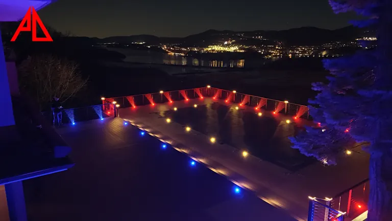 Night deck with red and blue rail lights above the valley