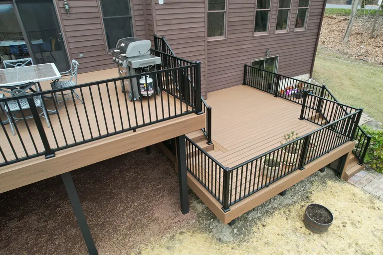 Two-level deck with black railing and stairs