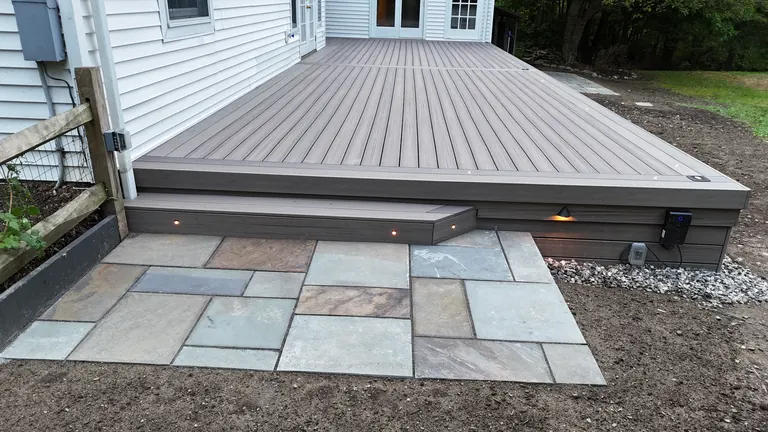 Low deck above a bluestone patio