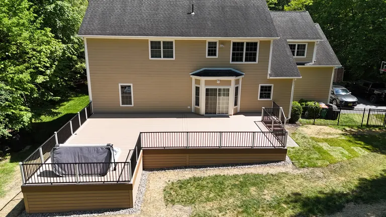 Low deck wrapping the back of a house