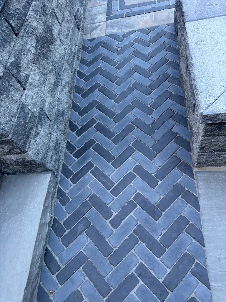 Detail close-up of a herringbone-pattern paver walkway, Rhinebeck, NY