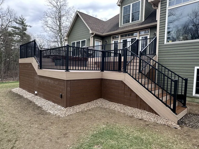 Finished stairs and skirting leading up to the multi-level deck