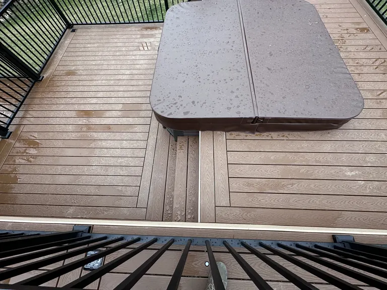 Close detail of the hot tub cover and deck skirting corner