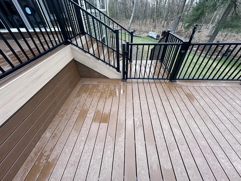 Wide clean decking floor with railing, empty