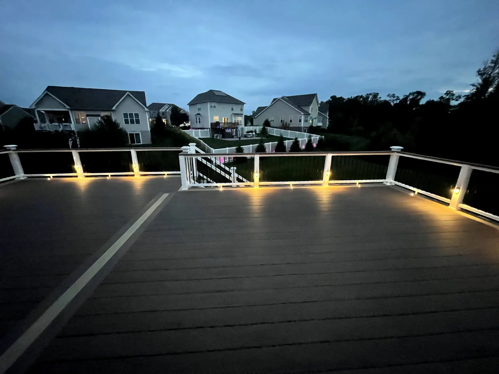 Trex deck and railing with Haven LED lighting at dusk