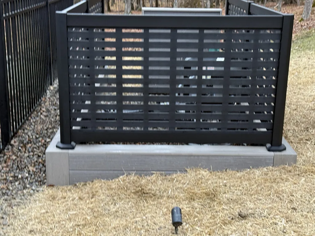 Black composite privacy screen panel on a paver base, Dutchess County, NY